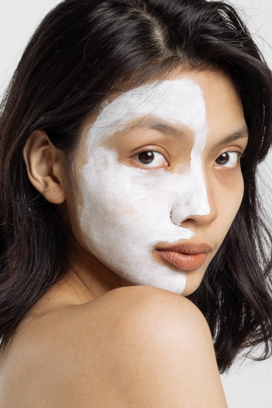 Portrait of Woman with Cream on Half of Her Face